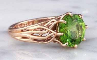 tree of life engagement ring in rose gold with peridot