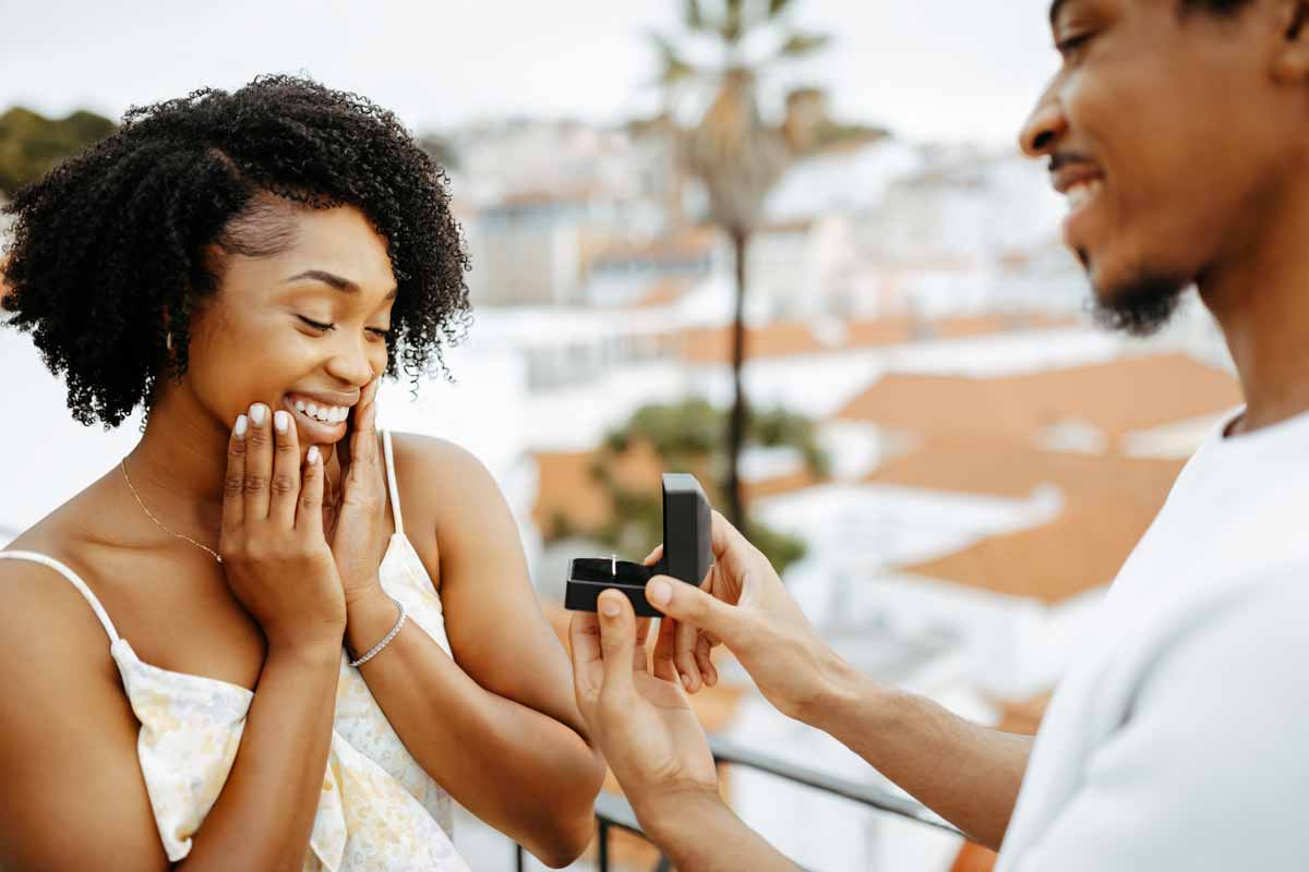 A man proposes to a surprised girlfriend