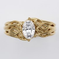 Oval Moissanite with Embracing Tree Branch Engagement Ring