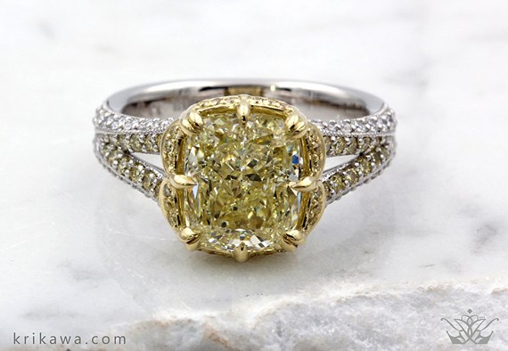 Natural fancy colored yellow diamond in engagement ring